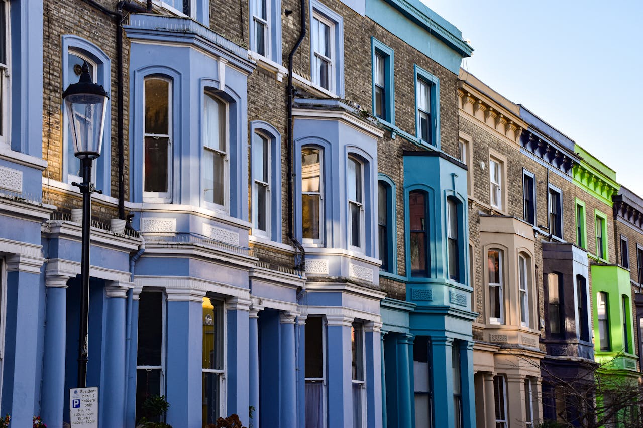 Vibrant Victorian townhouses in London showcasing classic architecture and vivid colors.